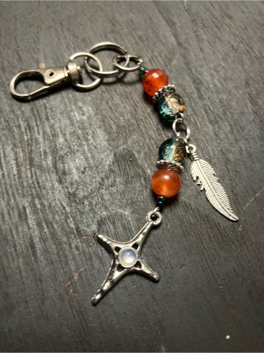 Orange,teal glass beads/silver star/feather charm/keychain